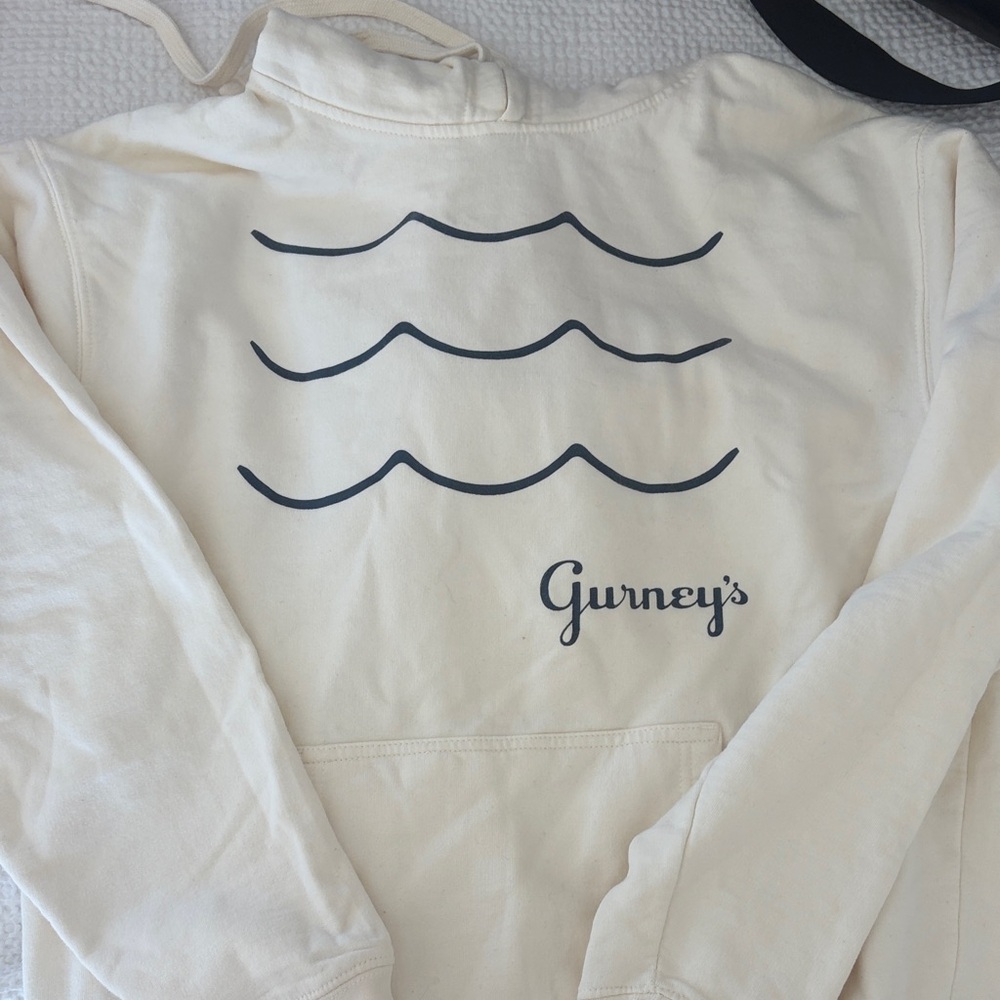 Gurney's Montauk Cream Pullover Hoodie with Navy Wave Graphic